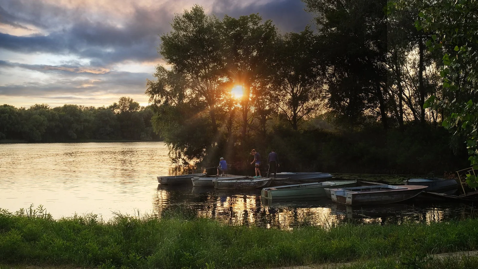 Evening light over boats by the river in Prochorovka